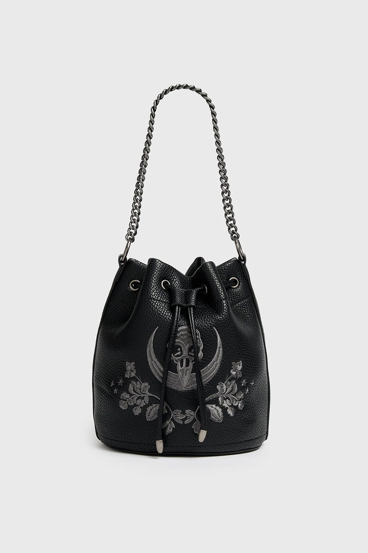 Black bucket bag with floral and skull embroidery on a white background