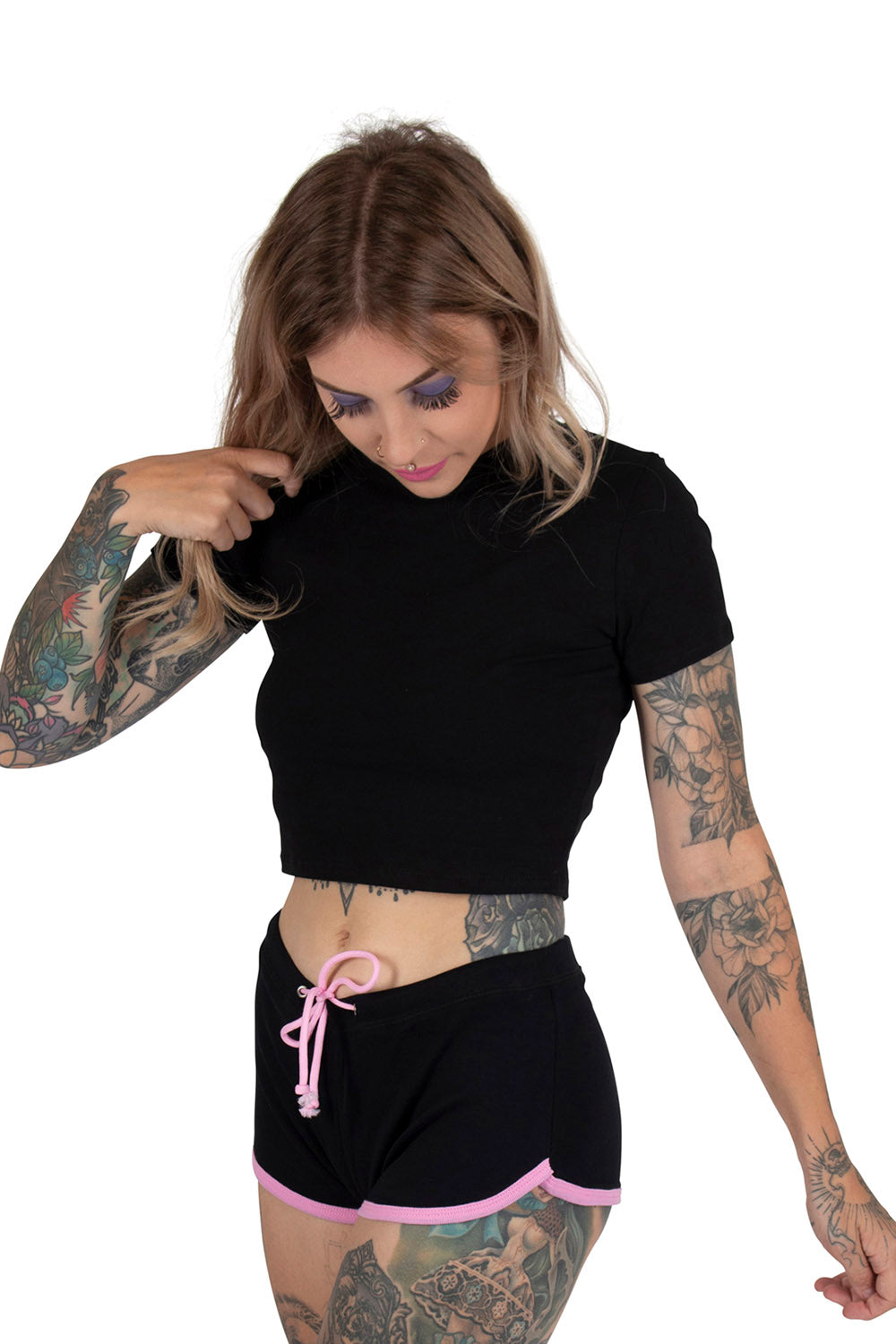 pink and black emo shorts with skull and crossbone graphics 
