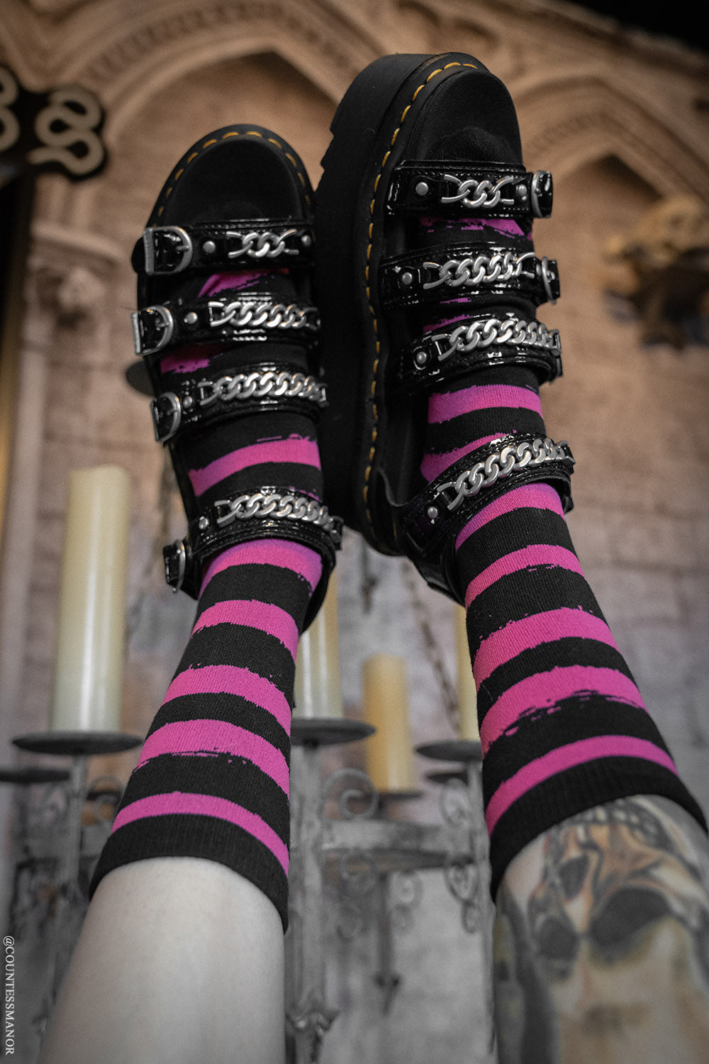 pink and black striped spooky crew socks