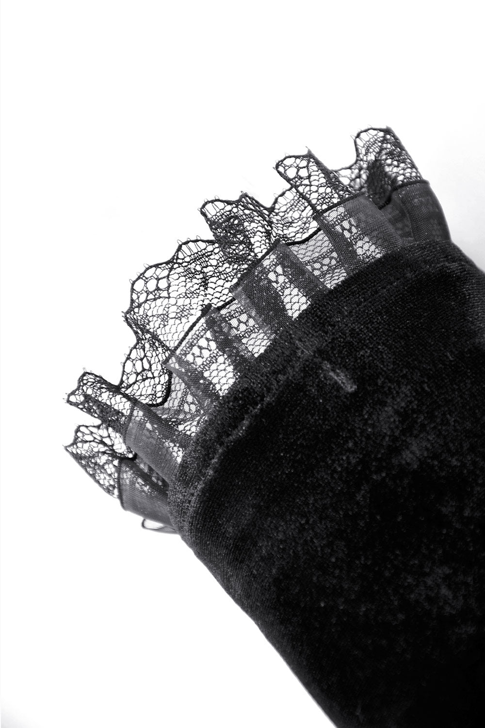 Lace detail of long black arm warmers