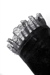 Lace detail of long black arm warmers