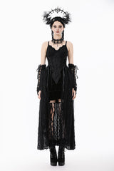 Woman wearing a black gothic outfit with lace details on a white background