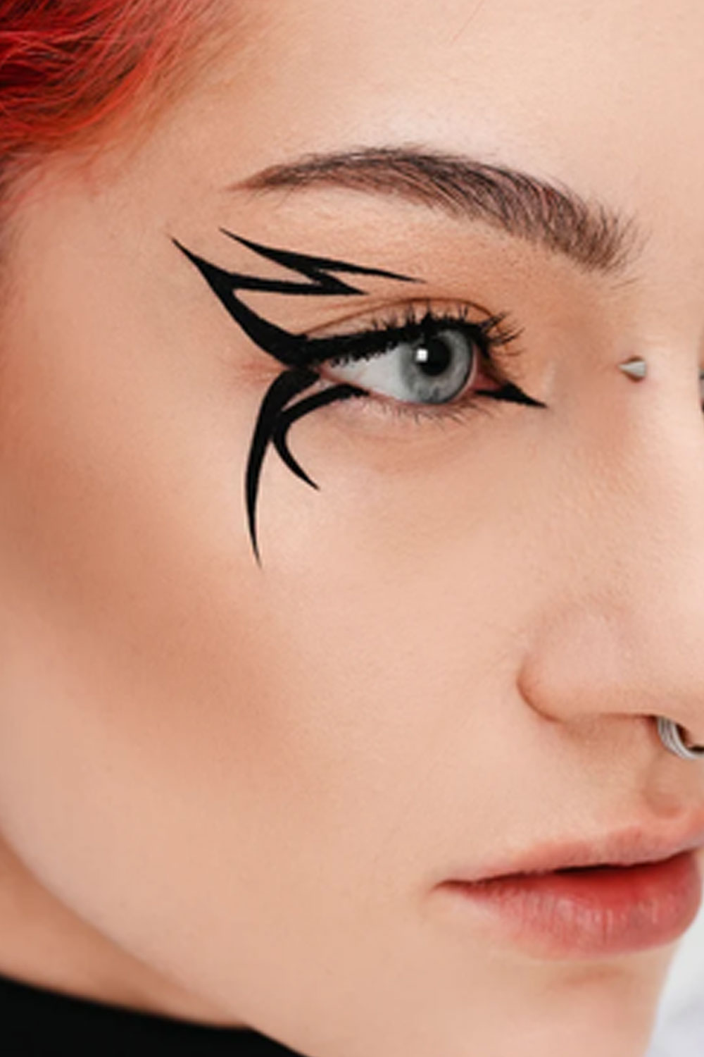Bold winged eyeliner look featuring Medusa’s Makeup Witchy Liner for long-lasting, waterproof goth and punk beauty
