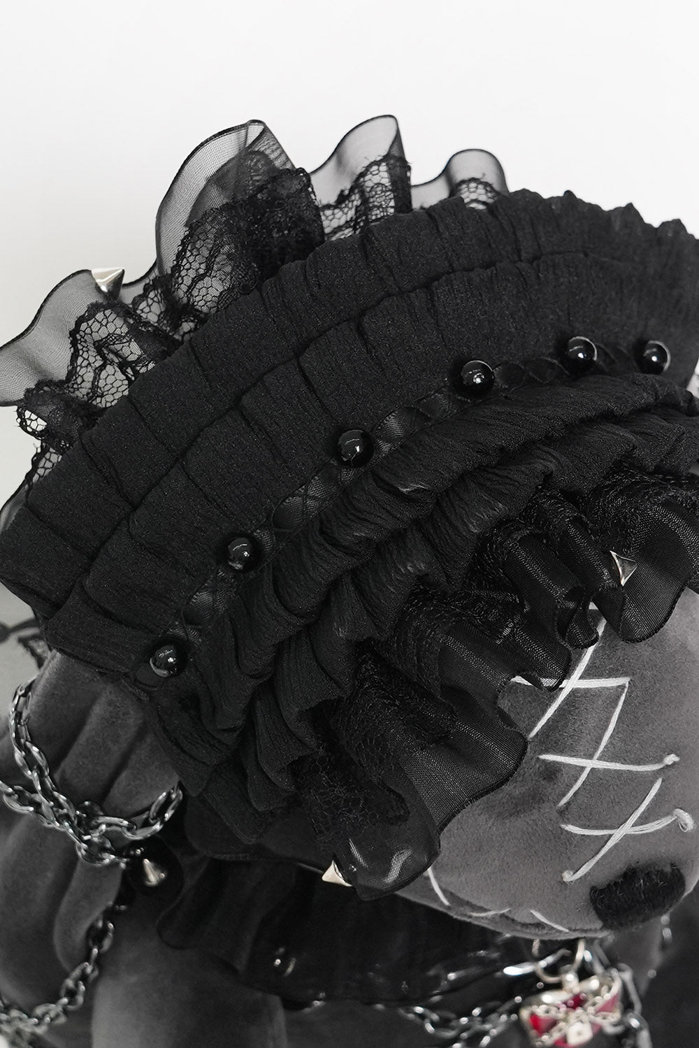 spooky cute chained punk rabbit plush toy wearing a lolita ruffle headband 