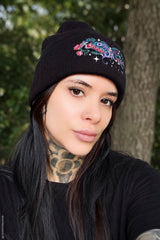 knitted black beanie hat with colorful cottagecore garden moth decal