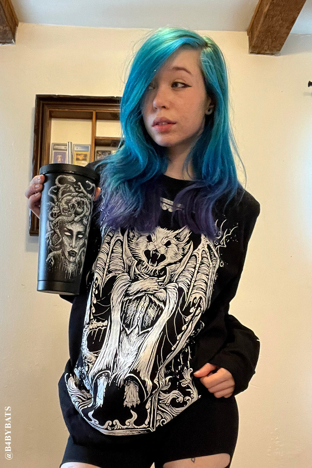 egirl holding medusa cup