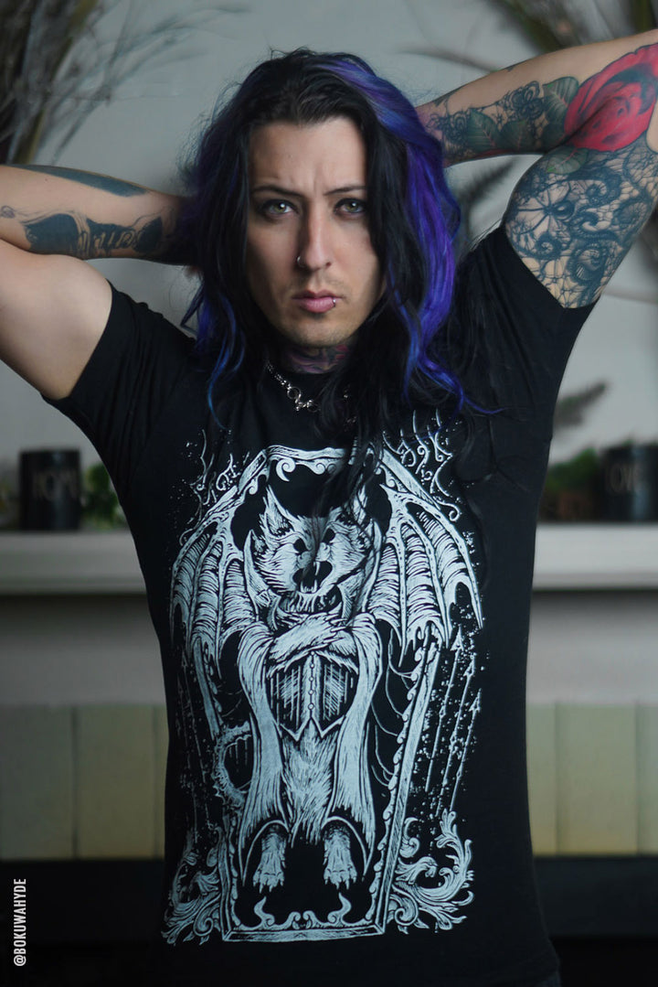 man wearing a gothic graphic tshirt