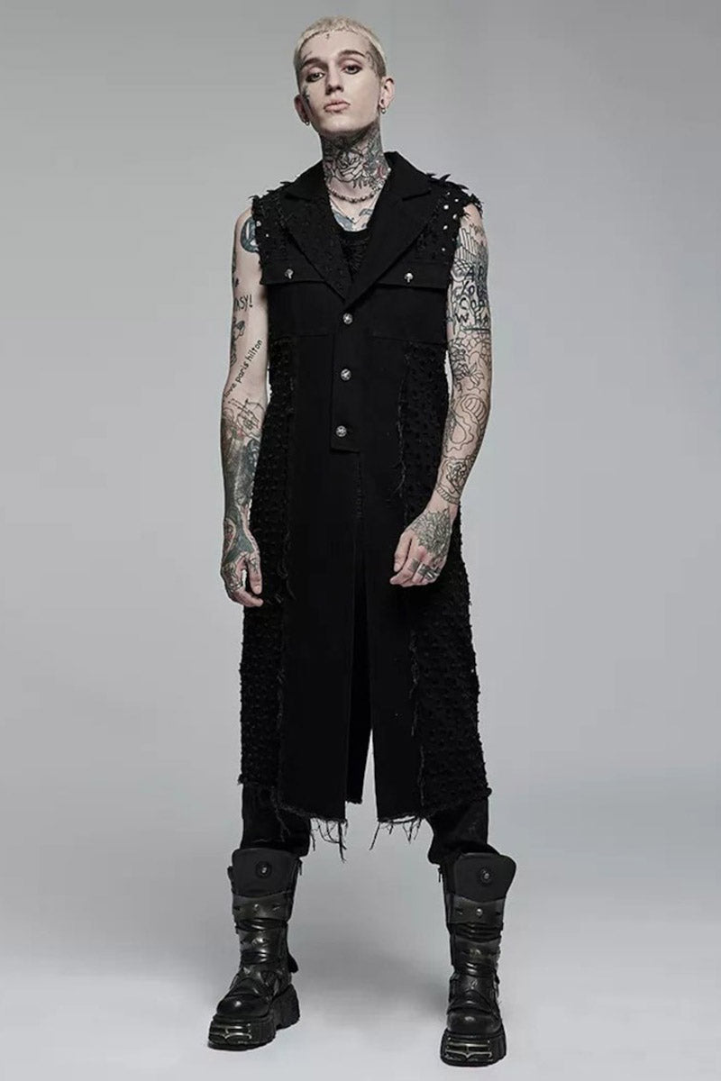 Person wearing a black sleeveless vest and pants with tattoos on a gray background