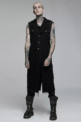 Person wearing a black sleeveless vest and pants with tattoos on a gray background