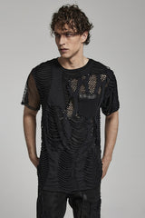 A male model wearing a black distressed shirt with fishnet details and a front pocket, paired with black pants.