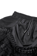 short stretchy layered ruffled skirt with attached train in the back with drawstring waist 