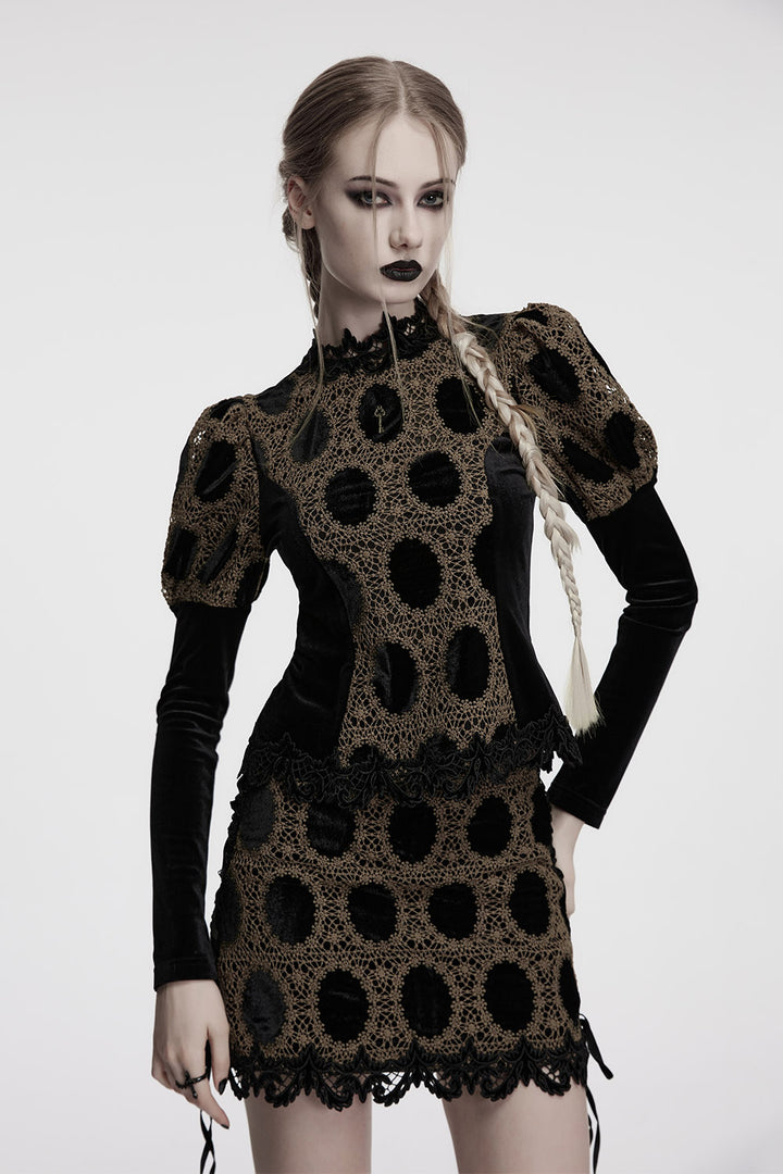 Woman wearing a black and brown patterned blouse on a white background