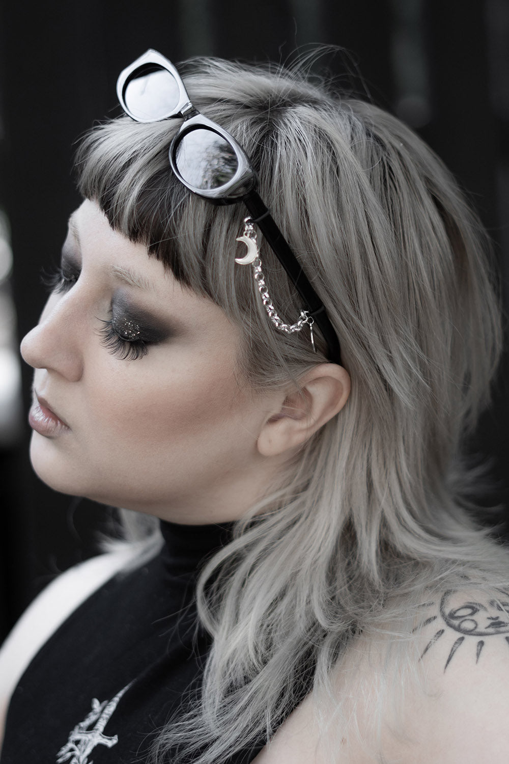 street goth thin oval black sunglasses with crescent moon charms 