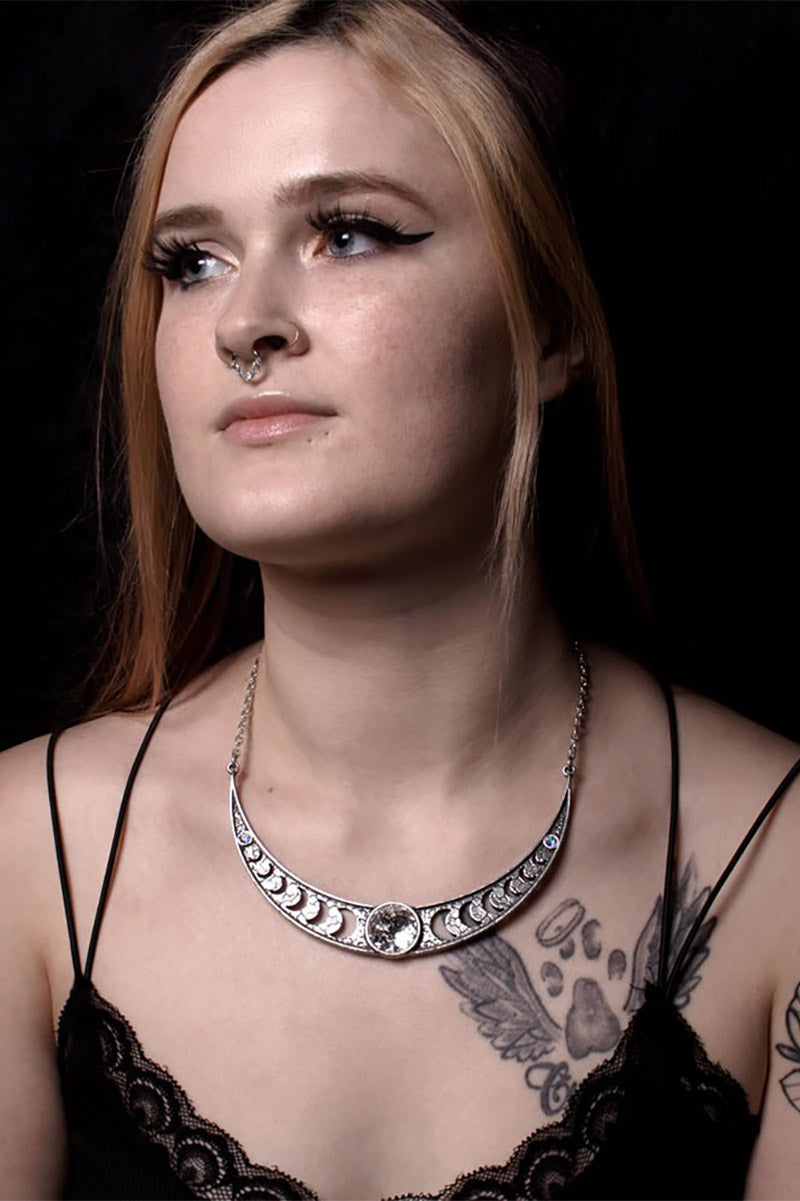 witchy silver necklace with crescent moon cutouts