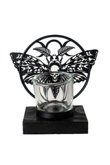 tea light candle holder with moth sculpture on the front made of metal