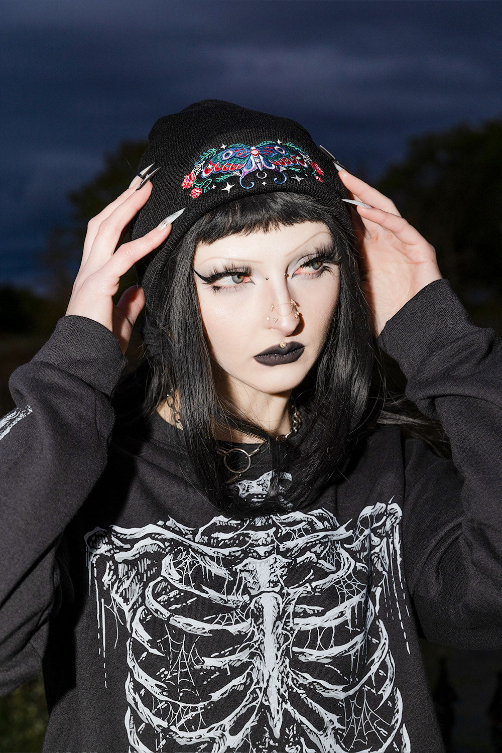 Soft black gothic winter beanie with enchanted luna moth artwork for dark academia witchcore and occult inspired accessories