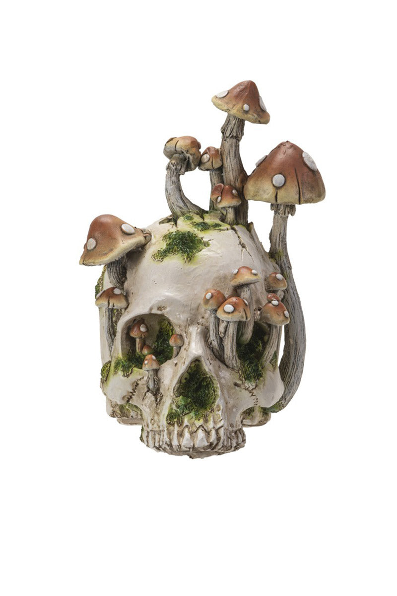 skull statue with mushrooms