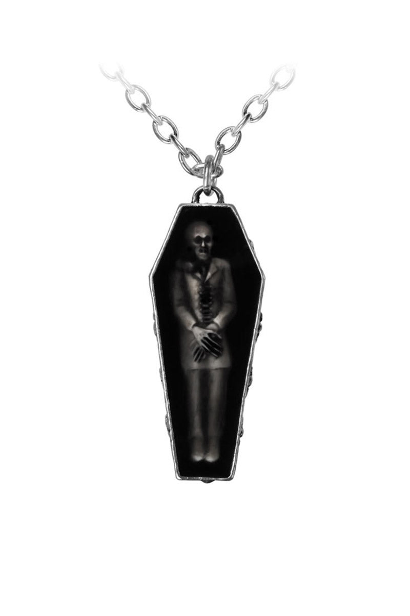 Coffin-shaped pendant with a vampire inside on a white background