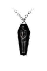 Coffin-shaped pendant with a vampire inside on a white background