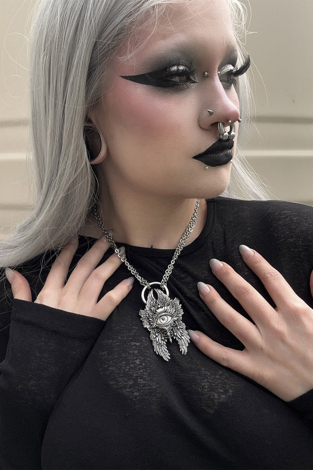 gothic girl wearing occult jewelry accessories 