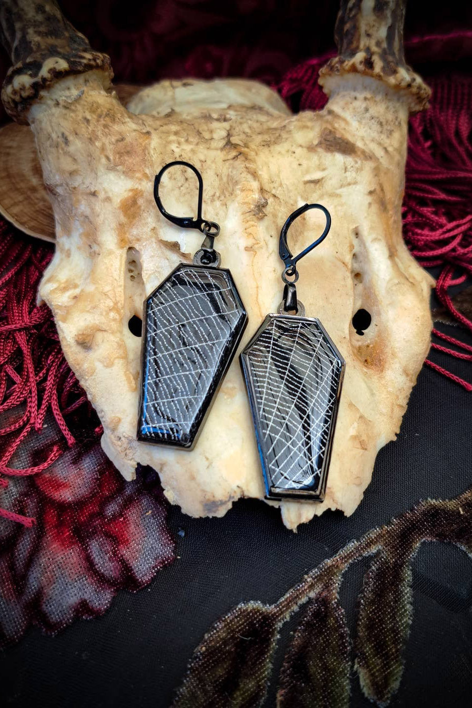 spooky coffin spider earrings