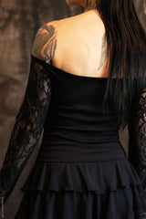 Model wearing off shoulder black top with lace sleeves from VampireFreaks