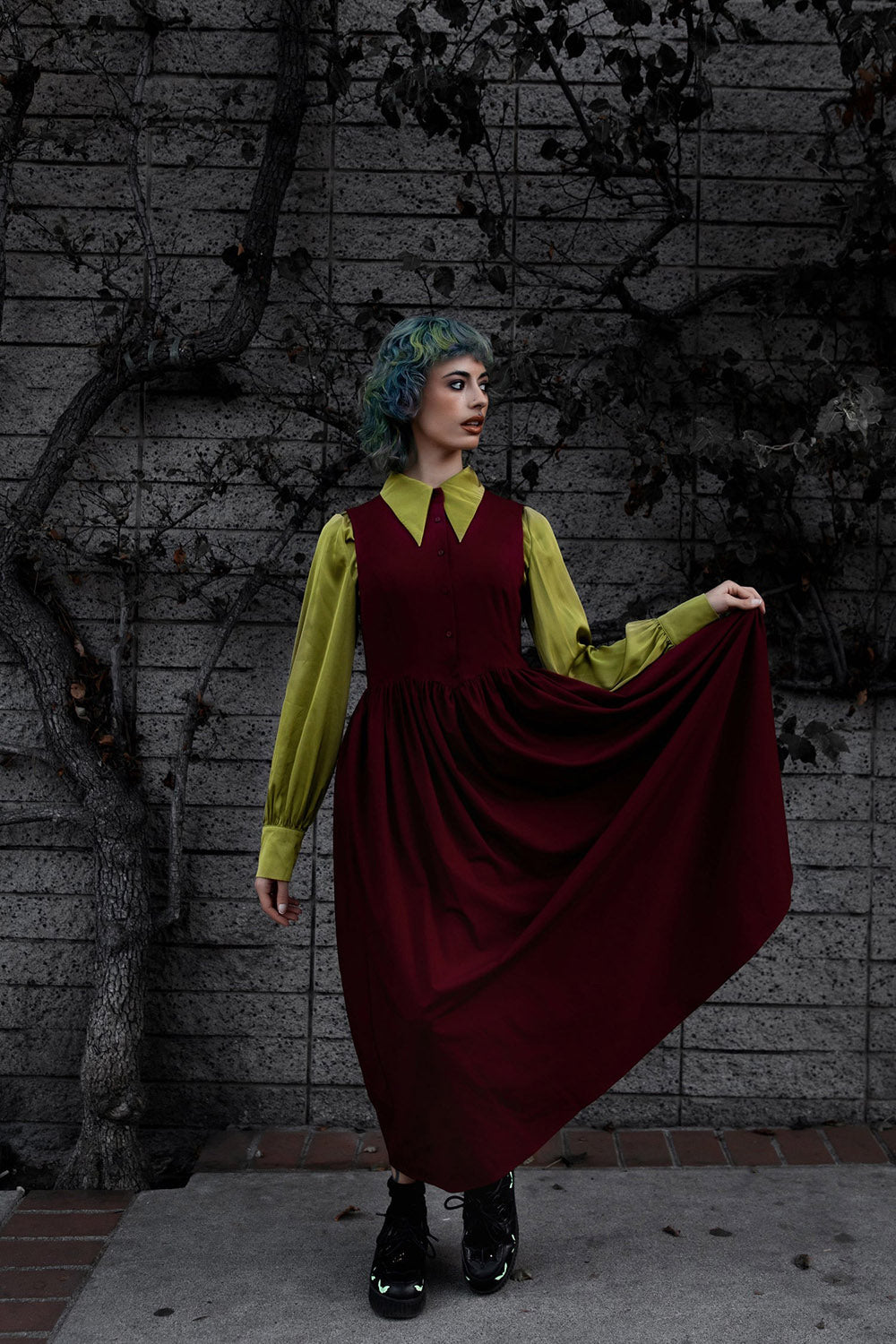 long sleeve collared witch top and a red dress