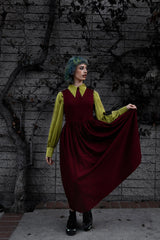 long sleeve collared witch top and a red dress