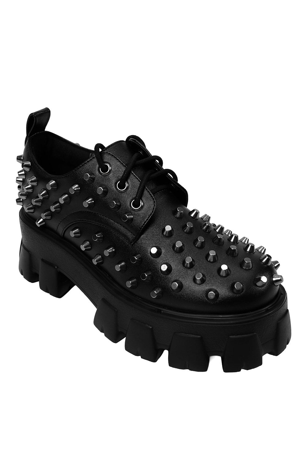 Black spiked platform shoe on a white background