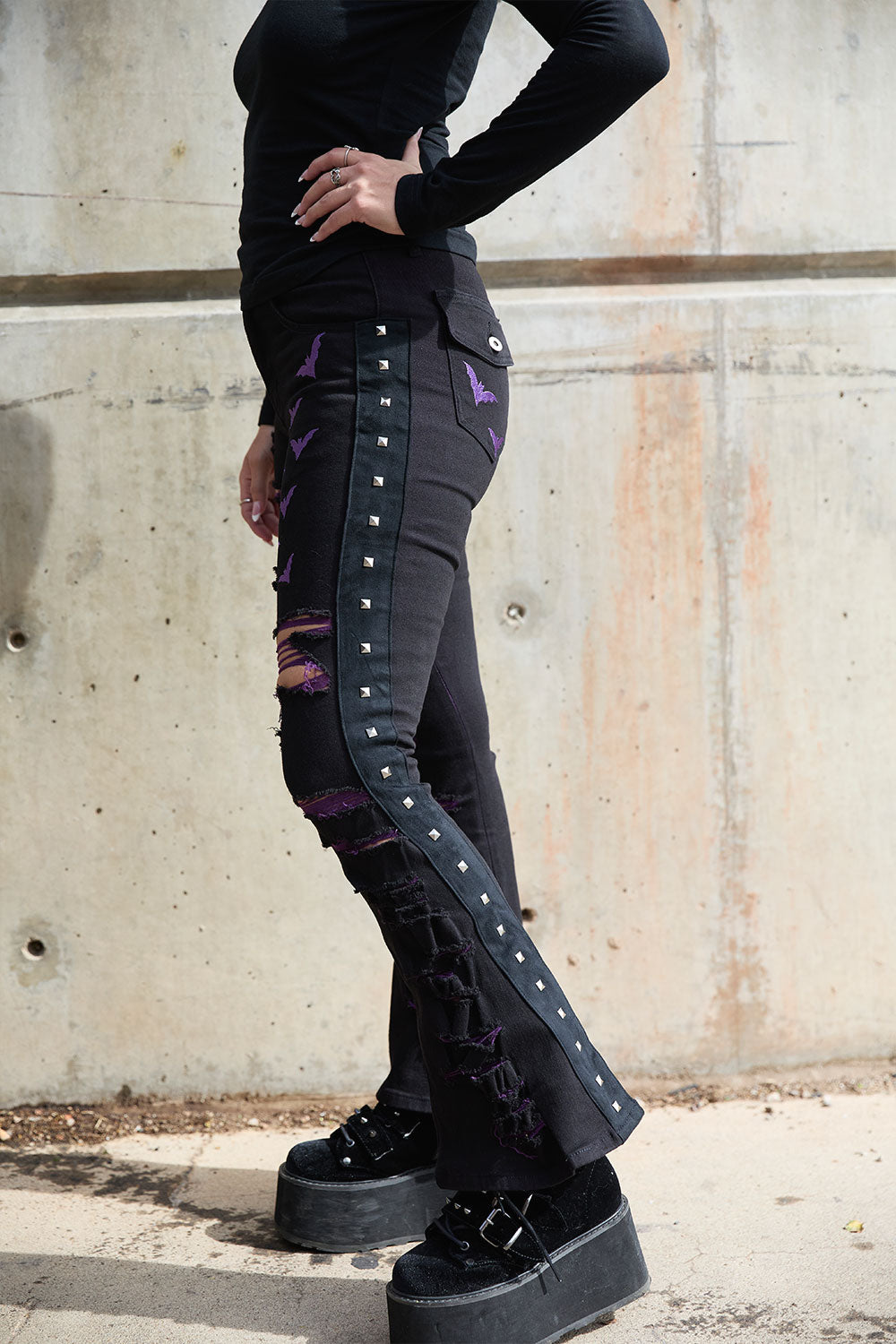 punk black pants with metal pyramid studs down side of legs