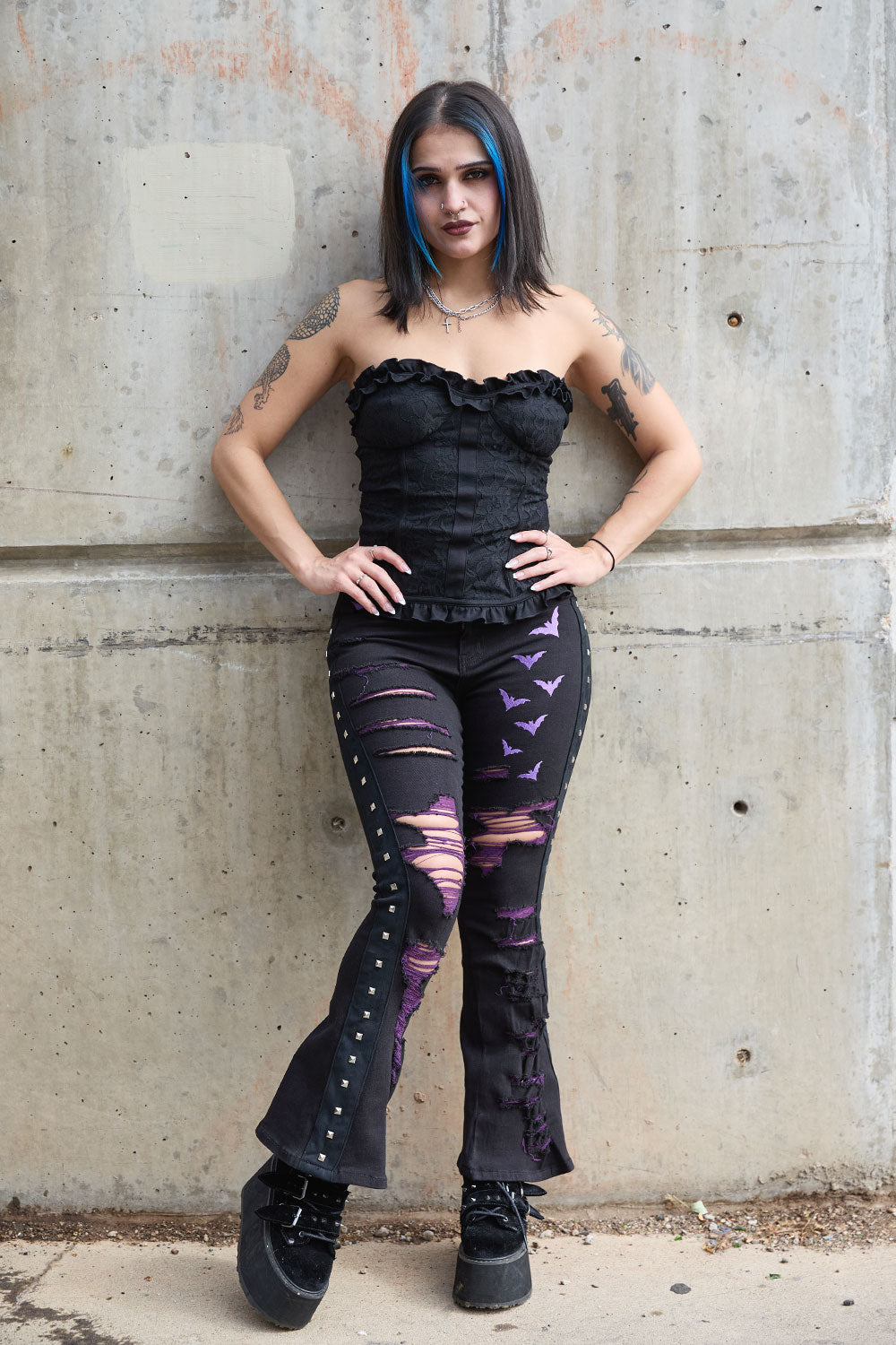 Punk grunge high waisted black denim womens flare pants with embroidered purple bat detail