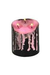pretty pastel pink and black bleeding wax candle 