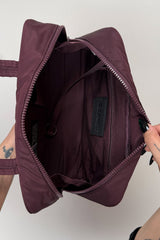 inside a dark red embroidered spiderweb recycled nylon gothic baguette shoulder bag 