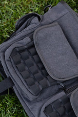Dark alternative tactical shoulder bag with distressed grey fabric metal D rings and utility pouches for punk grunge and emo outfits