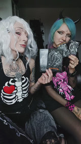 video of gothic girls with goth stickers, cthulhu blanket, gothic clothing, and more