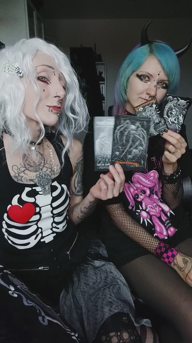 video of gothic girls with goth stickers, cthulhu blanket, gothic clothing, and more