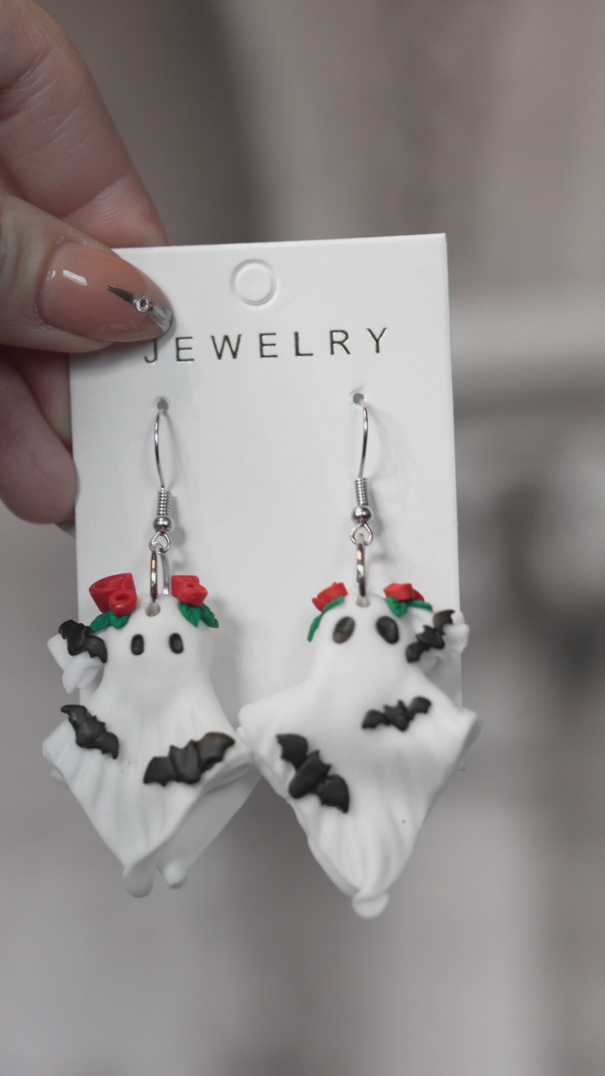 video of a 3d polymer clay 3d whimsical novelty ghost earrings