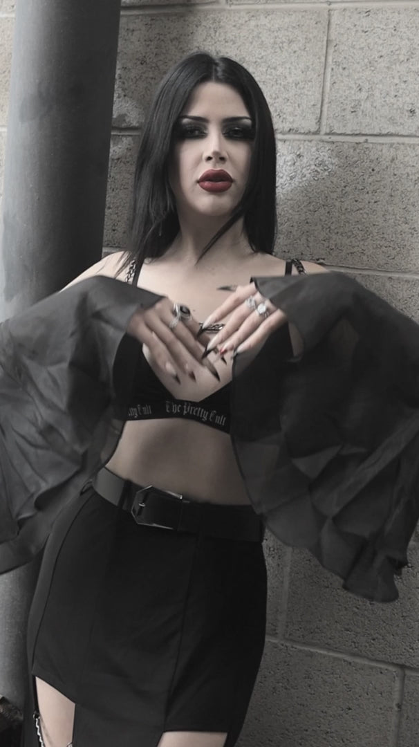 video of woman wearing vampire goth bell sleeve bolero 
