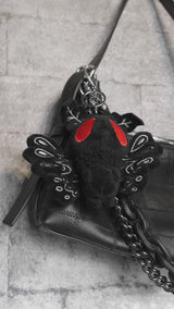 vide of spooky cute mothman plush keychain