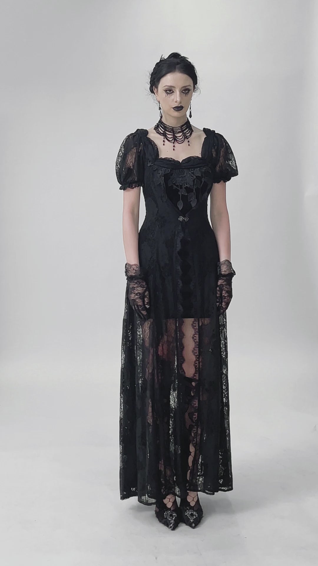 video of a gothic woman wearing a lace-up long gothic maxi gown