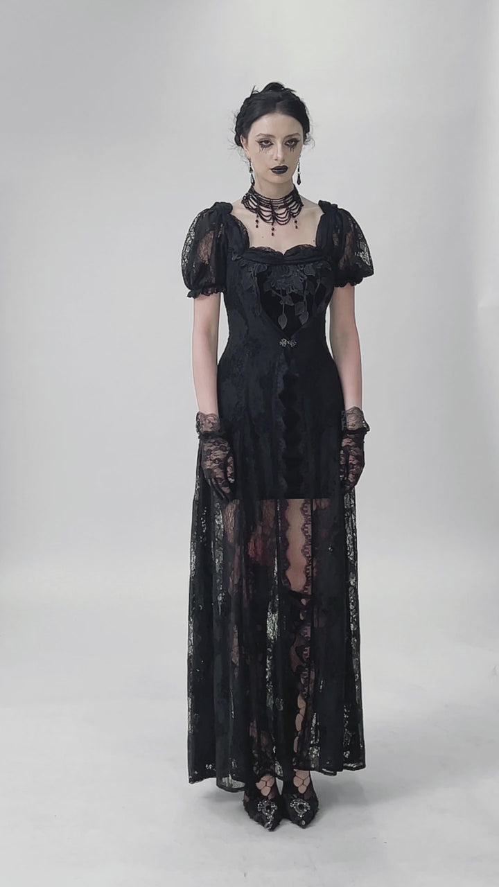 video of a gothic woman wearing a lace-up long gothic maxi gown
