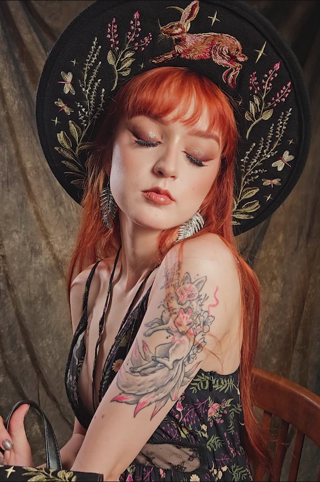 video of fairycore irl wearing embroidered floral fantasy hat 