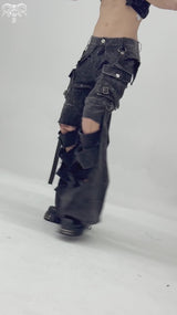 video of a gothic man wearing buckled punk pants
