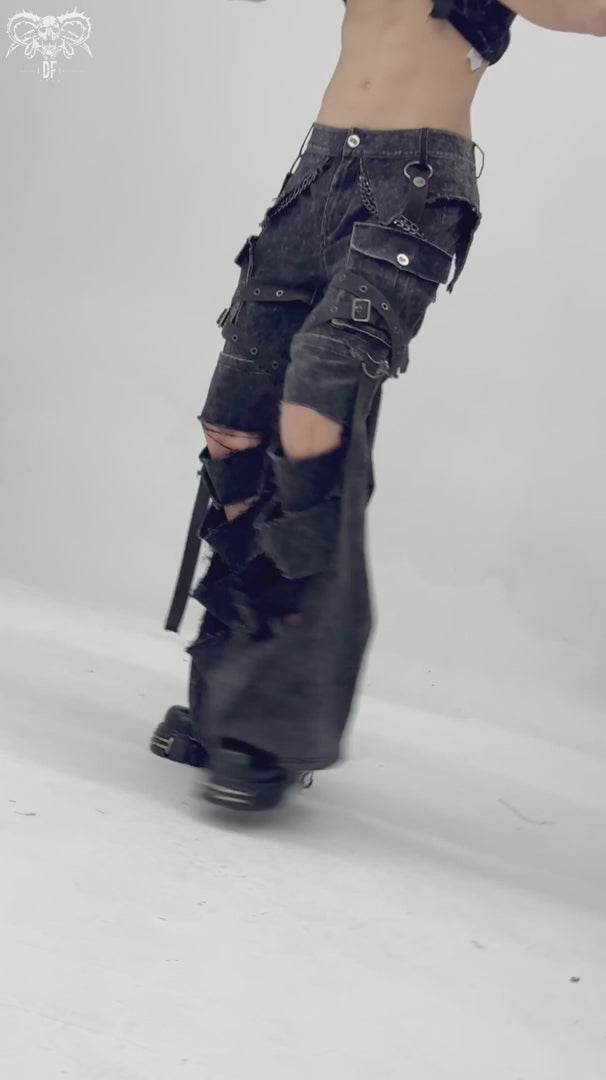 video of a gothic man wearing buckled punk pants