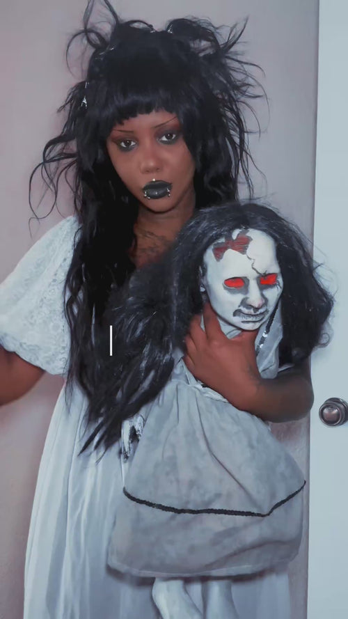 emo woman wearing a gothic outfit 