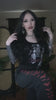 video of a gothic woman wearing gothic clothes in a try on haul