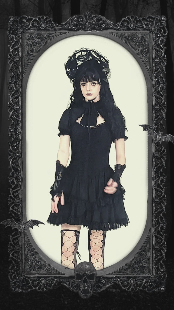 video of woman wearing gothic lolita gloves with lace and flowers