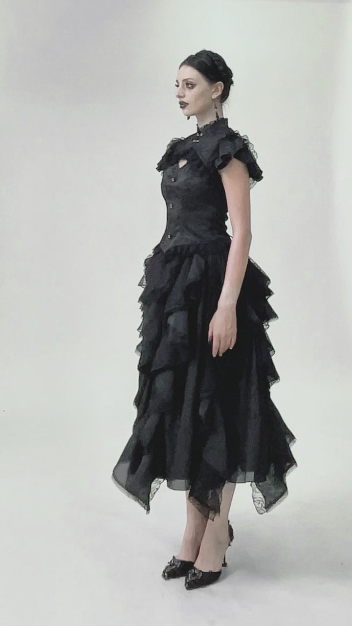 video of a gothic girl wearing a lace corset short sleeve top
