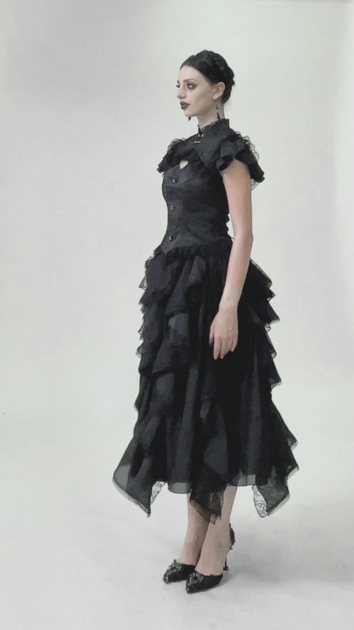 video of a gothic girl wearing a lace corset short sleeve top