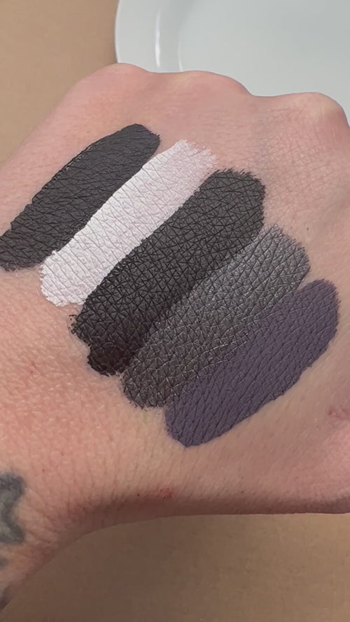 video showing shades of grey, black, and white lipstick by mermaid salon